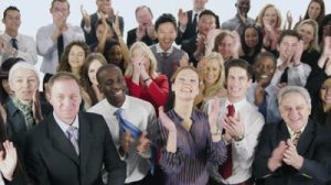 stock-footage-a-large-multi-ethnic-group-of-business-people-stand-together-isolated-on-white-in-a-studio-shot